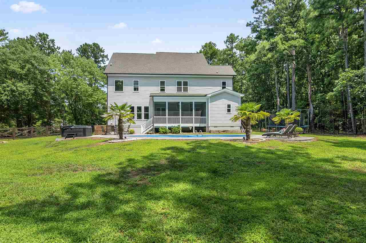 Rear elevation with pool and lawn